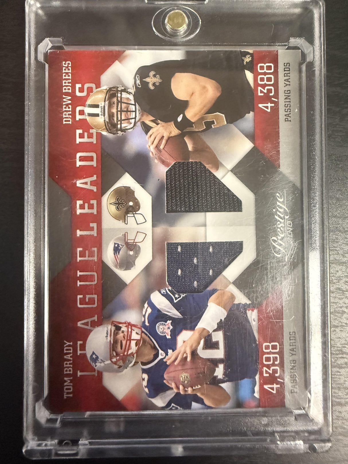 2010 Panini Prestige #3 Tom Brady / Drew Brees League Leaders Materials